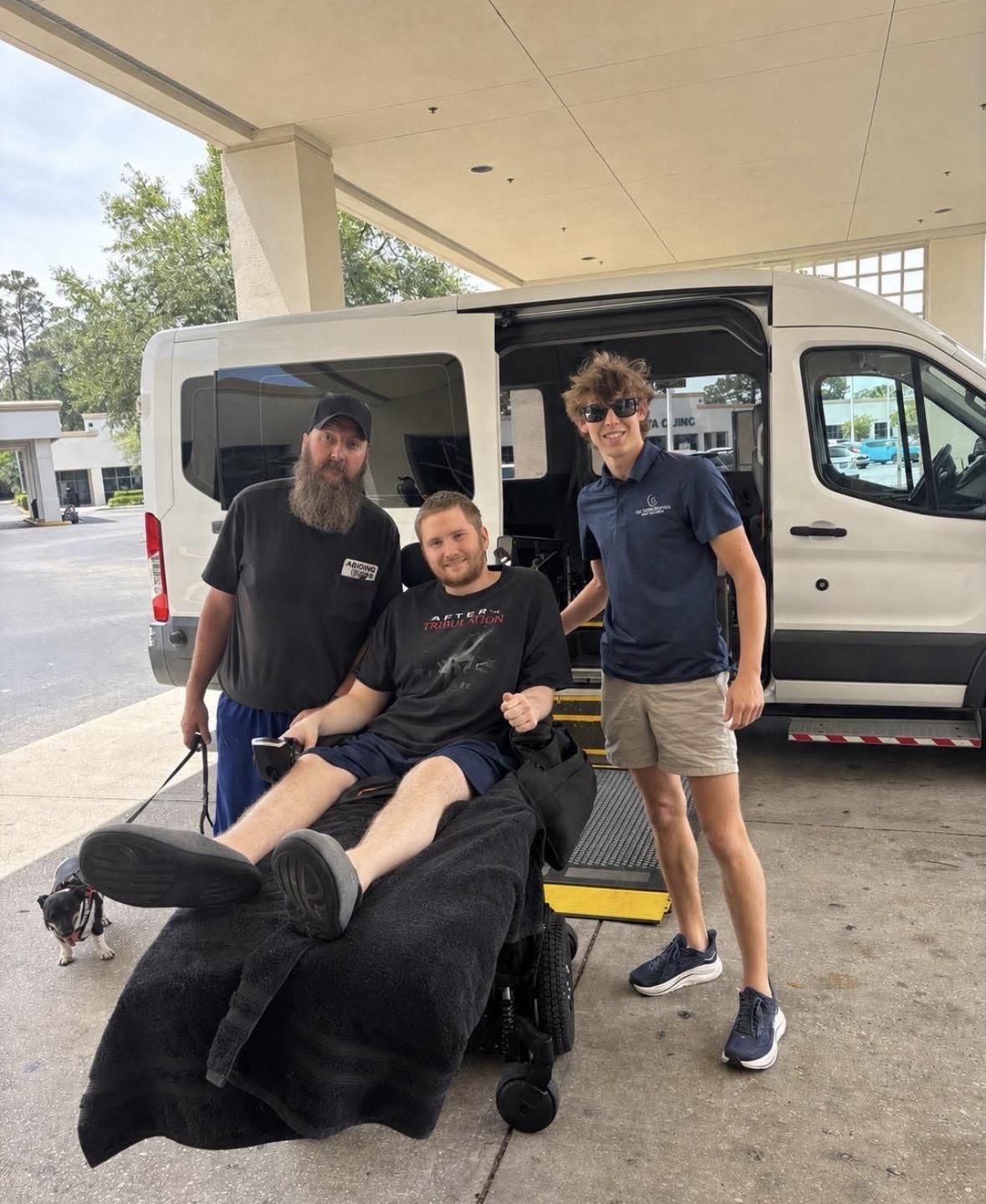 Q's Transportation driver with a rider and staff member at a hotel pickup