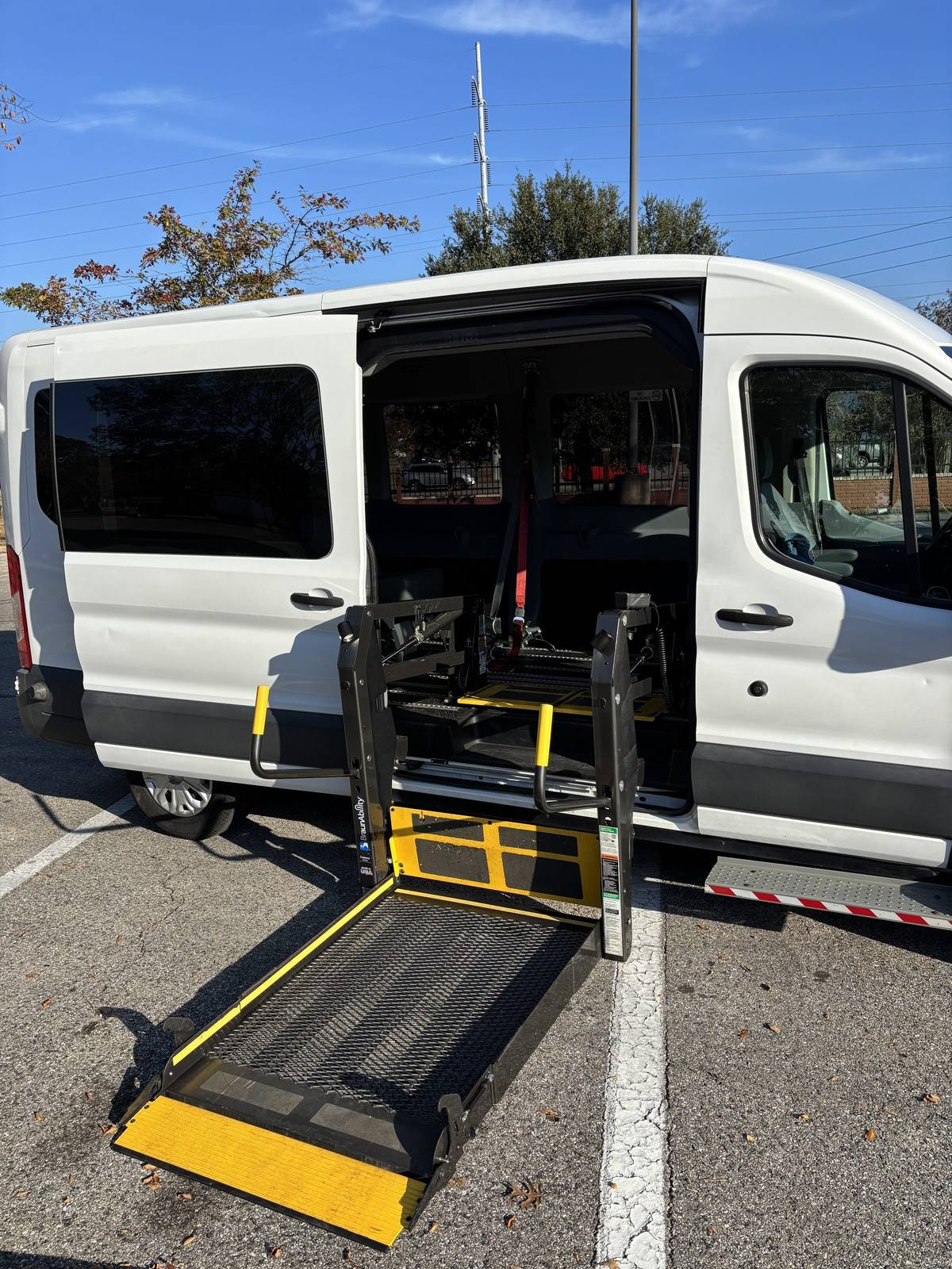 Hydraulic wheelchair lift deployed on the van